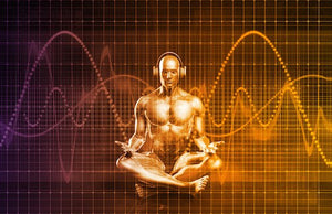 benefits of meditation - image of man with headphones on sitting in meditation position