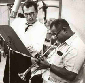 dave brubeck image with louis armstrong, dave is looking over louis armstrongs shoulder as louis plays the trumpet
