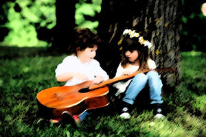 Rafa Selase relaxing music for kids image of a little boy with guitar and girl no more than 4 years old sitting on the grass with their backs against a tree